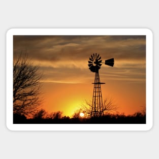 Kansas Blazing orange sunset with a Windmill silhouette with clouds. Sticker